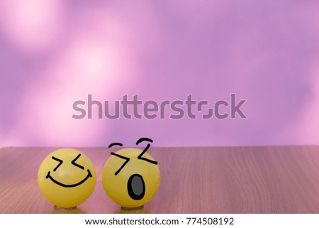 Smiley face yellow balls with bokeh wall background and copy space