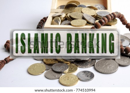 Coins in the wooden box and rosary. Islamic finance/banking concept