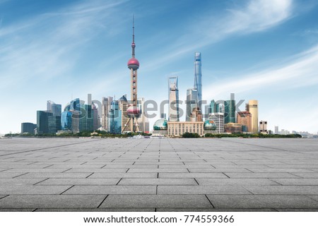 clean asphalt road with city skyline background,shanghai,china.
