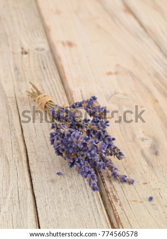 Dried bunch of lavender flowers on wooden desk