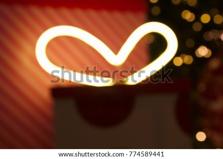 The heart shape from the light with Bokeh pattern background, Holiday abstract pattern background for Christmas or Valentine concept.