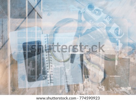 Top view of desktop with camera, smartphone and notepad on abstract city concept. Hobby concept. Double exposure