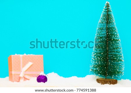 Christmas tree and gift on blue background