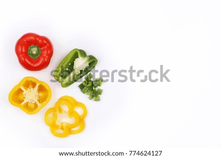 Red, green and yellow bell peppers on white background, top view with copy space