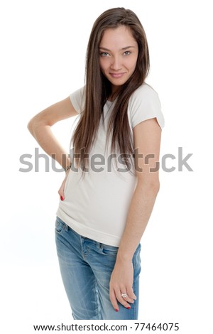 Standing young woman wearing jeans and a white t-shirt