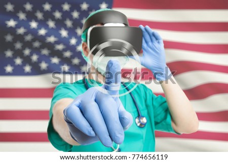 Indoors shot of a surgeon testing virtual reality glasses with USA flag on background