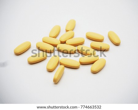 Assorted pharmaceutical medicine pills, tablets and capsules over white background Royalty-Free Stock Photo #774663532