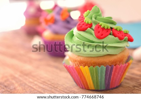 Beautifully decorated cupcake on table, closeup