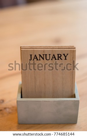January on wooden board