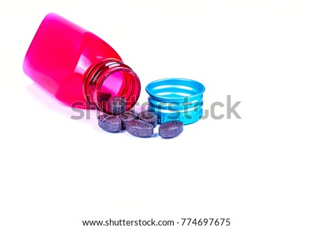 Red plastic bottle open the lid,Supplementary food isolated on white background.