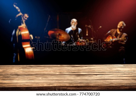Desk of free space for your decoration and three men. Music background 