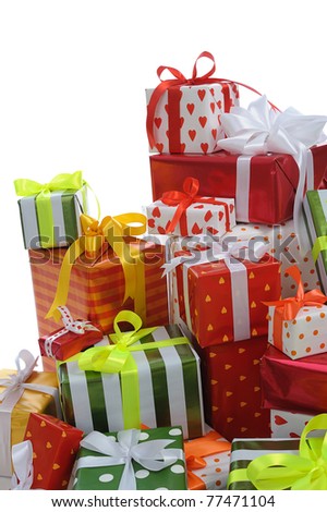 stack of festive gift boxes decorated with satin bow isolated on white background