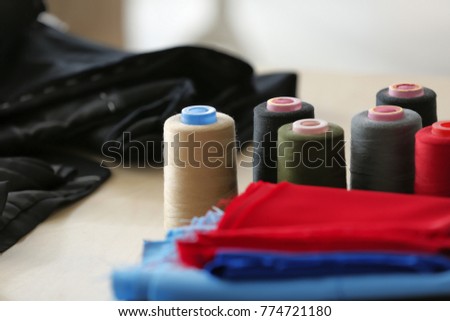 Colorful sewing threads on table