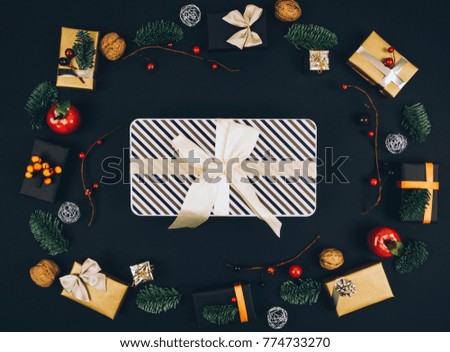 Christmas new year black stylish background and frame with gifts. Top view.