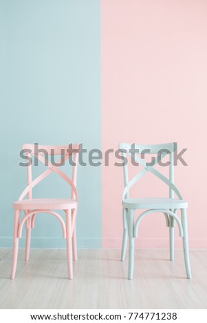 Vintage pastel vertical wooden chair Painted on Two Tone background Royalty-Free Stock Photo #774771238
