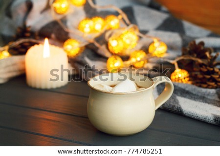 Picture of hot tasty cup of coffee with marshmallow