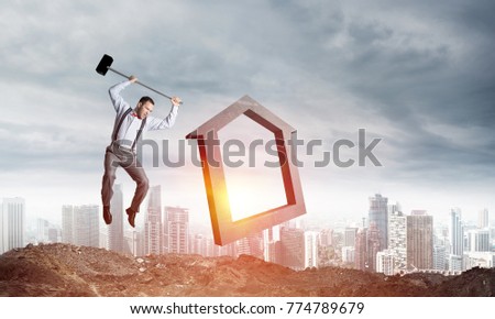 Jumping businessman crashing big house symbol with city view and sunlight on background. 3D rendering.