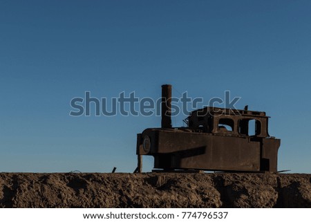 Old rusty locomotive trains rest amongst the saltpeter nitrate ghost town of Humberstone Chile