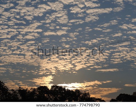 The beautiful sunset sky with the blue sky and clouds in summer