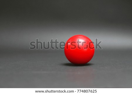 Red balls on a black table