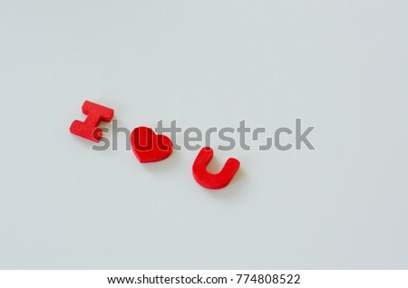 Happy valentines day concept. I love you alphabets and heart symbol in red color on white background.