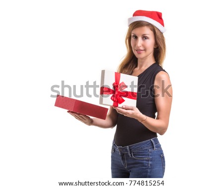 Beautiful caucasian wearing red christmas hat and holding new year gift box. Studio shooting isolated on white background