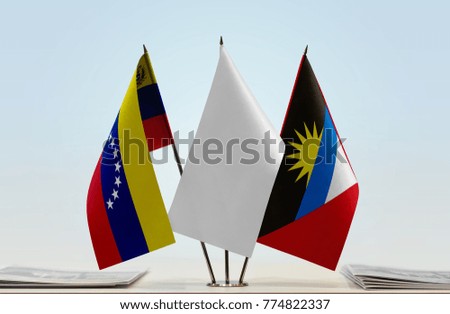 Flags of Venezuela and Antigua and Barbuda with a white flag in the middle