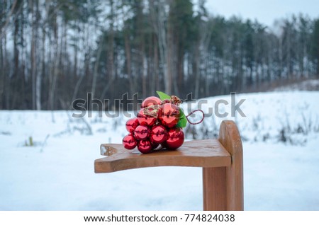 Christmas decorations on a stand in the woods in winter
