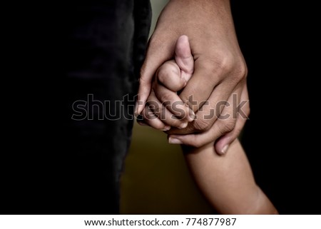 family, generation, support and people concept -senior man and child holding hands Royalty-Free Stock Photo #774877987