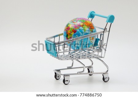 Global shopping concept. Globe on the shopping cart.
