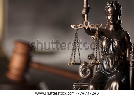 Courtroom concept. Blind justice, mallet of the judge. Gray stone background. Place for typography. Royalty-Free Stock Photo #774937243