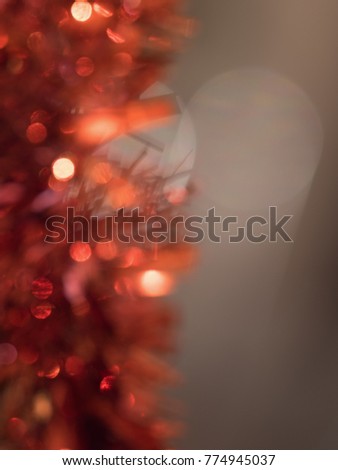 Abstract red New Year's tinsel on a dark background