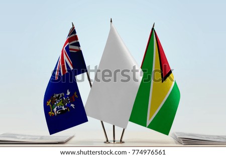 Flags of South Georgia and
South Sandwich Islands and Guyana with a white flag in the middle