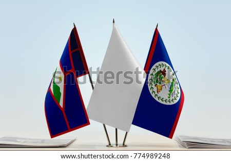 Flags of Sint Eustatius and Belize with a white flag in the middle