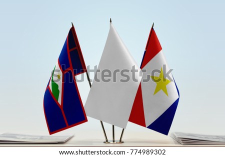 Flags of Sint Eustatius and Saba with a white flag in the middle