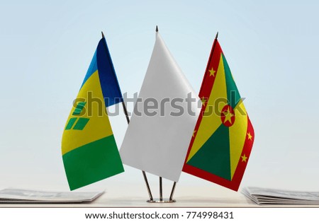 Flags of Saint Vincent and the Grenadines and Grenada with a white flag in the middle