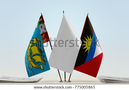 Flags of Saint Pierre and Miquelon and Antigua and Barbuda with a white flag in the middle