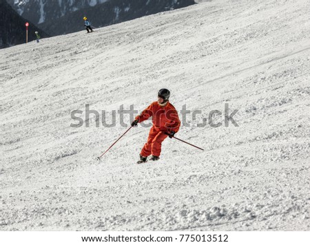 The young woman on a mountain-skiing slope of the resort of Mayrhofen on a sunny day - Austria