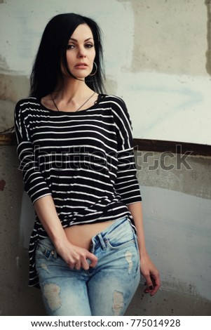 Beautiful young woman in a striped T-shirt