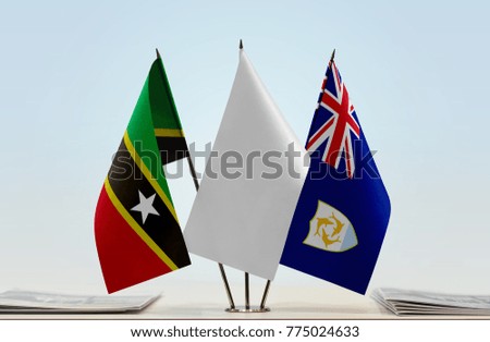 Flags of Saint Kitts and Nevis and Anguilla with a white flag in the middle