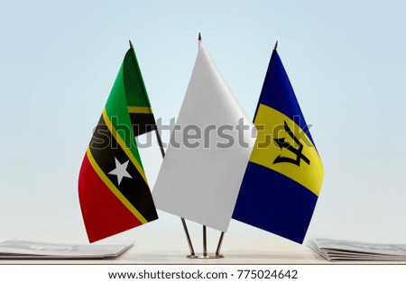 Flags of Saint Kitts and Nevis and Barbados with a white flag in the middle