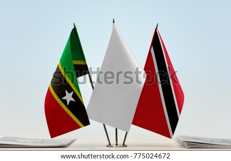 Flags of Saint Kitts and Nevis and Trinidad and Tobago with a white flag in the middle