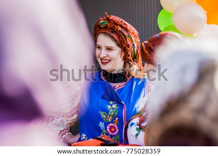 Girls in national dress show the show Royalty-Free Stock Photo #775028359