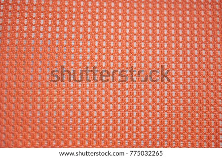 Fabric plaid texture. Cloth background orange color