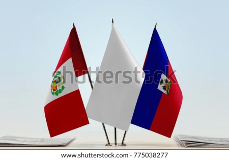 Flags of Peru and Haiti with a white flag in the middle