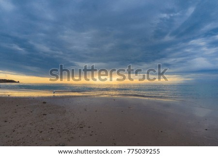 Sunset on a beach with dramatic sky nature background