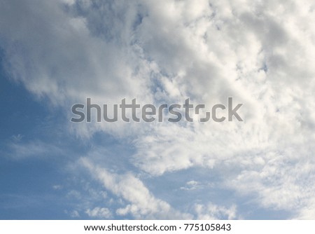 Fluffy white clouds in front of a blue sky. This photo was taken in Brisbane, Australia.