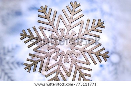 Photograph of some wood painted snowflakes symbols