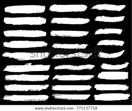 Collection of hand drawn white grunge brushes. Vector Grunge Brushes. Dirty Artistic Design Elements. Creative Design Elements. Banner. Black background with white stripes made with brush.
