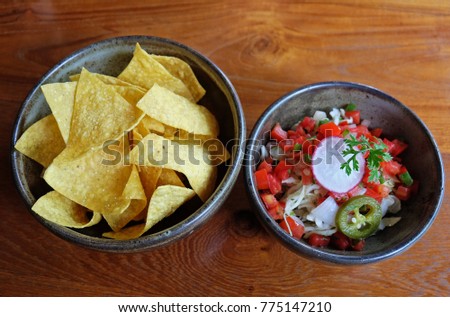 Close up Nachos with fresh Mexican Salsa salad